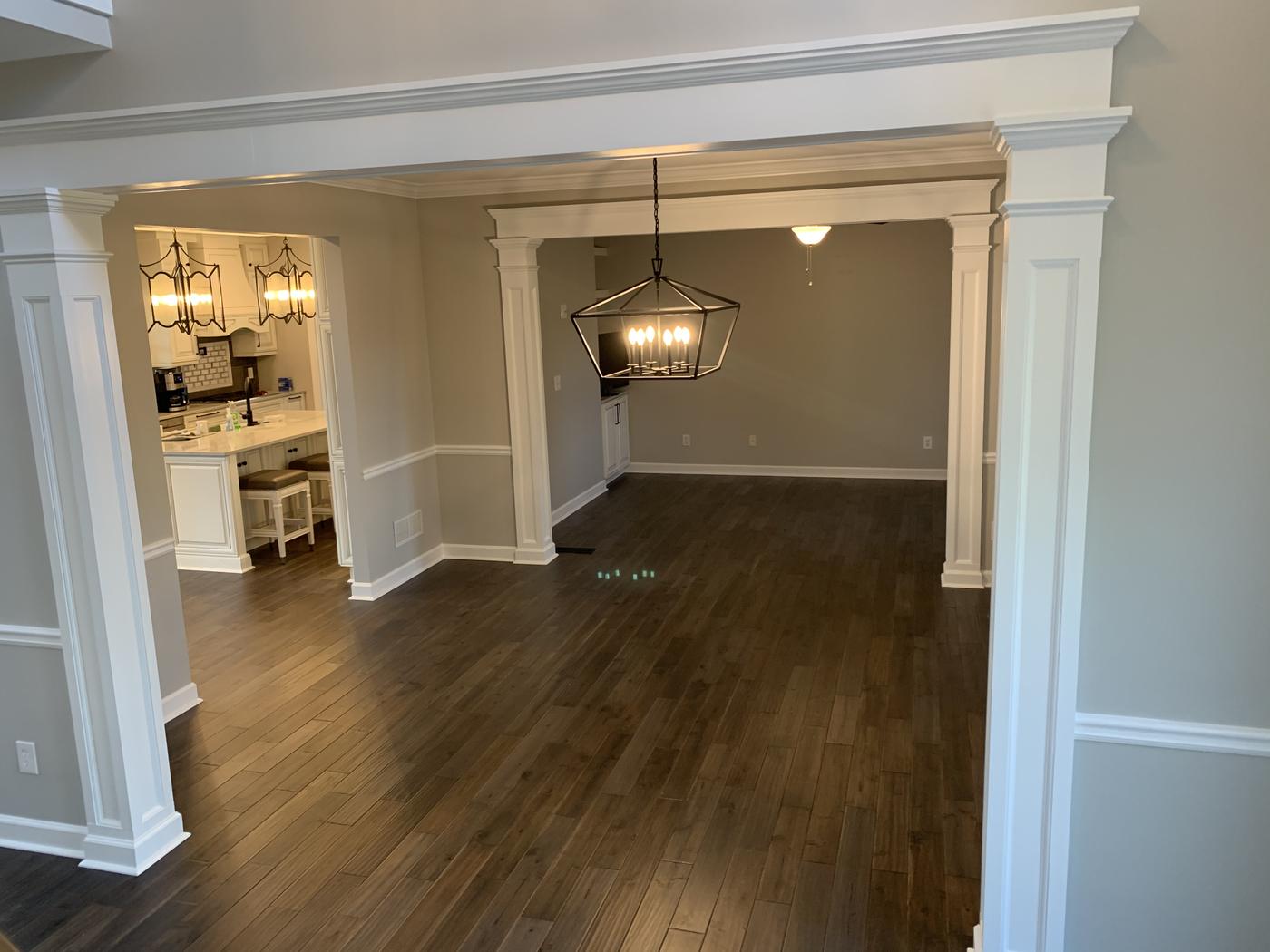 Columned openings between dining room and kitchen